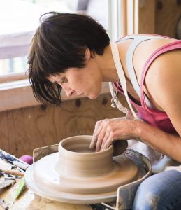 Sarah Lindley at the pottery wheel