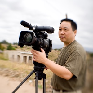 A photo of Professor Danny Kim filming a video