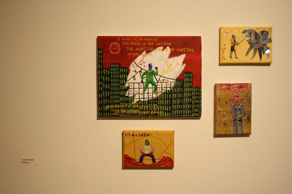 Four paintings by student (Van Webster) hung on wall